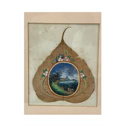 19th century Chinese peepal or sacred fig leaf painting of a lake landscape in an oval panet within a floral surround, framed 18cm x 15cm