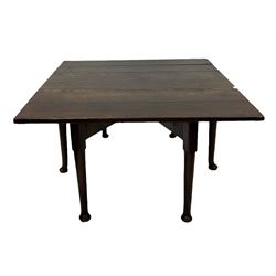 Late 18th century oak drop leaf table, raised on turned supports, terminating in pad feet