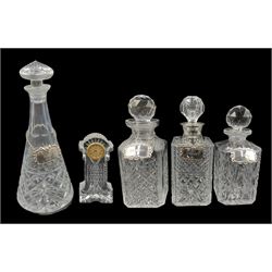 Square hobnail cut glass spirit decanter with silver collar Birmingham 1976 by C J Vander, two other spirit decanters, another of tapering form, four silver wine labels and a Waterforf glass clock H15cm