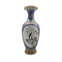 19th/ early 20th century Chinese Famille rose baluster form vase, decorated with two oval reserves of birds and flowers on a blue linked-wan ground, seal mark for Da Qing Qianlong Nian Zhi H25.5cm 