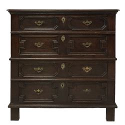 Jacobean design oak chest, the moulded edged top over four long panelled drawers, raised on stile supports 