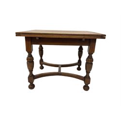 Early 20th century oak drawer leaf dining table,  raised on turned supports together with six chairs