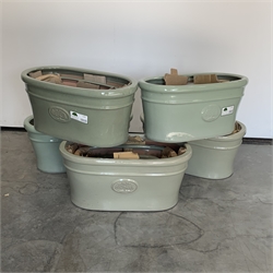  Five sets of three green glazed terracotta plant pots, W58cm  