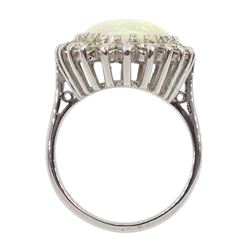White gold oval opal and diamond cluster ring, stamped 18ct, total diamond weight approx 1.00 carat