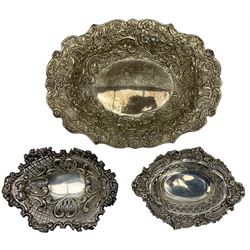 Late Victorian silver oval dish embossed with flowers, grapes and scrolls W26cm London 1896 Maker William Comyns & Sons, silver oval pedestal sweetmeat dish Birmingham 1893 and another sweetmeat dish London 1896 (3)