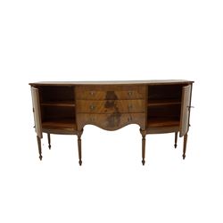 Georgian style mahogany serpentine sideboard, fitted with three drawers flanked by two cupboards, raised on reeded supports W168cm, H88cm, D54cm 