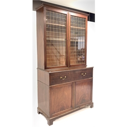 George III mahogany secretaire bookcase, glazed doors with brass grill enclosing three adjustable shelves, fall front drawer under revealing fitted interior, cupboard under, raised on shaped bracket supports, W126m, H234cm