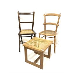 Two beech side chairs with cane seat panels, together with an oak framed stool with cane seat panel