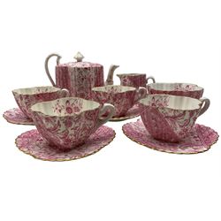 Late 19th century Wileman & Co. 'Cabaret' pattern tea set for four comprising teapot, milk jug, sugar bowl, four cups and saucers of fluted form decorated with panels of pink flowers with gilt edging with printed factory mark