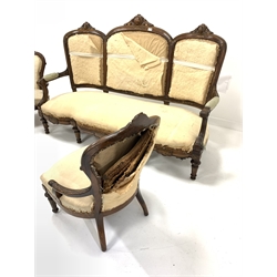Late Victorian rosewood four piece salon suite, comprising a three seat sofa with acanthus carved crest rail and incised scrolled decoration, open arms, serpentine front, raised on turned fluted and tapered supports, in deconstructed upholstery (W174cm) an open armchair (W58cm) and a side chair (W51cm) together with another matched open armchair (W59cm)