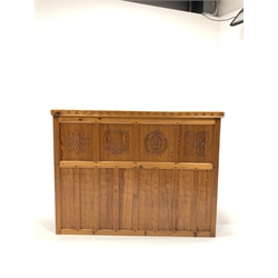 'Catman' pitch pine bar, adzed top over panelled front carved with floral roundels, open shelf, sliding doors and cupboard to reverse, by Chris Checksfield of Whitby (Ex Gnomeman) W140cm, H107cm, D79cm