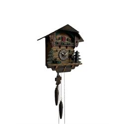 A Swiss made 20th century Cuckoo clock with automaton in a traditional chalet style case, movement sounding the hours and half hours with a gong and cuckoo call, two train weight driven 30hr movement. 
With an early 20th century German alarm clock in a 7” diameter metal case with two bells, gilt metal dial with Arabic numerals and alarm setting dial, wound and set from the rear.



