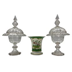Pair of Victorian glass comports and covers with cut decoration on facet cut baluster stems H33cm, one cover rivetted, and a 19th century Rockingham vase decorated with a panel of birds and flowers on a green ground H15cm, puce griffin mark, rim repaired (3) 