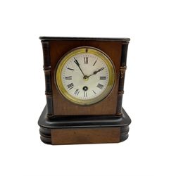 French timepiece mantle clock c1890 in a mahogany case with ebonised detail, enamel dial with roman numerals and steel spade hands, within a cast brass bezel and flat bevelled glass. With pendulum.