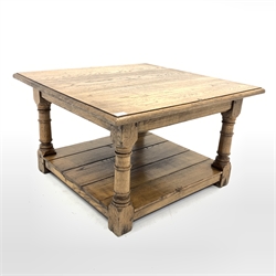 Solid oak coffee table, with square top raised on turned and block supports, united by under tier, 76cm x 76cm, H46cm