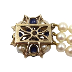  Three row cultured pearl bracelet, two spacers set with diamonds, on gold cabochon sapphire, diamond and pearl clasp   