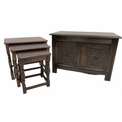 20th century oak coffer, hinged lid revealing plain interior over reeded frieze and floral carved two panel front, raised on stile supports (W84cm) together with a nest of three oak and beech tables (W52cm)