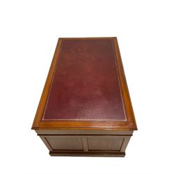 Georgian design mahogany pedestal desk, the leather inset top over nine drawers, raised on a plinth base W153cm, H76cm, D91cm  