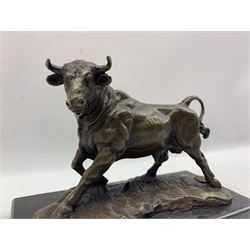 Bronze figure, modelled as a prancing bull, upon a naturalistic base signed Mils and with foundry mark, raised upon a rectangular marble base, overall H14cm