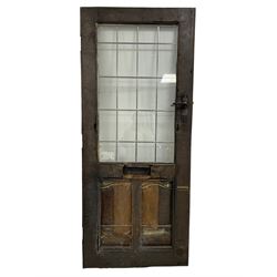 Mouseman - oak exterior door, lead-glazed window over two panels, relief carved mouse signature, with wrought metal door furniture, by the workshop of Robert Thompson, Kilburn  