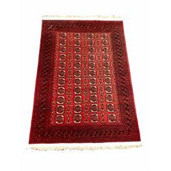 Persian Afghan hand knotted Bokhara ground rug, with repeating gull motif enclosed by a multi line boarder 206cm x 320cm
