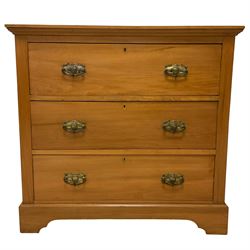 Edwardian satin walnut straight-front chest, fitted with three drawers with pressed metal handles decorated with urn motifs, on bracket feet