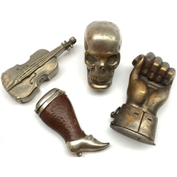 Four novelty vesta cases comprising plated skull, plated cello, leather and plated case in the form of a lady's leg marked Deponirt and another in the form of a gauntlet