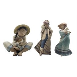 Pair of Lladro Gres figures from the Children with Animals series 'Mountain Shepherd' No2163 and 'My Lost Lamb' No2164 H22cm and a Gres figure 'Boy's Best Friend' No2226 H22cm  (3)