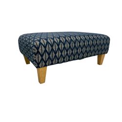 DFS - deep armchair upholstered in blue and white geometric patterned fabric, with matching footstool