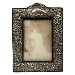 Edwardian upright silver photograph frame with embossed floral decoration, aperture 13cm x 9cm Birmingham 1909 