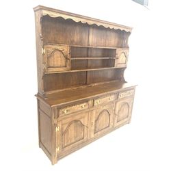 Bevan Funnel oak dresser, the plate rack with open shelves and two cupboards over three drawers and three cupboards to base, W183cm, H187cm, D46cm