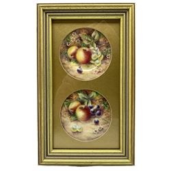 Pair of early 20th century saucers in the style of Royal Worcester, each hand painted with a still life of fruit, set within gilt frame and mount, apertures 7.5cm  