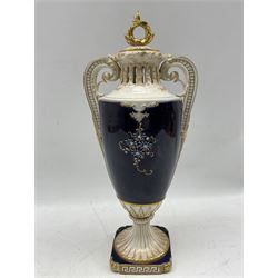 Riessner Stellmacher & Kessel for Turn Teplitz porcelain urn and cover, of typical twin handled form with acanthus leaf moulded handle, pierced neck, the body painted with a bust of a Maiden within an applied floral border, fluted pedestal square base, stamped beneath, H37cm