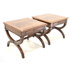 Pair Bevan Funnell Reprodux walnut and mahogany lamp tables, cross banded moulded top over one drawer, raised on reeded 'X' frame base united by turned stretcher