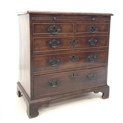 Early George III mahogany bachelors chest of small proportions, with brushing slide over two short and three long graduated cock beaded drawers, fitted with open mouth drop handles, raised on shaped bracket supports W77cm, H78cm, D45cm