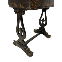 Early 19th century Chinoiserie work or sewing table, the hinged lid decorated with foliate and faint figural scenes, the interior fitted with various lidded compartments, carved bone handles, shaped and pierced end supports on paw carved sledge feet 