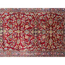 Persian red ground runner, the field decorated with overall floral Herati design, three-band border, the central band with repeating pattern decorated with stylised flowerhead and leaf motifs