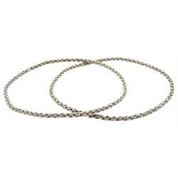 Two 18ct white gold bangles, stamped K18  