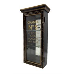 Ebonised display case with glazed door and later stencilled lettering 'Chanel No 5' 61cm x 30cm