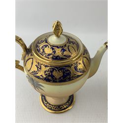 Noritake tea service for four persons, decorated with the Camel and Desert scene, comprising teapot, sucrier, milk jug, four trios and a jar and cover with lion mask handles, H18cm