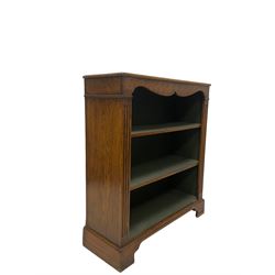 20th century oak open bookcase, fitted with two adjustable shelves, raised on bracket supports 