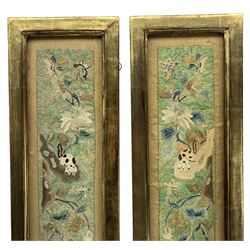 Pair of 19th century Chinese embroidered silk sleeve panels, finely worked in gold thread Peking knot depicting dogs, rockwork, butterflies and flowers on a green brocade ground, in gilt frames, 58cm x 18cm (framed) Provenance: From the Estate of the late Dowager Lady St Oswald