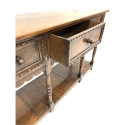 Early 20th century oak dresser base, fitted with three drawers over turned supports united by pot board base 141cm x 46cm, H81cm