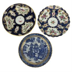 Two First Period Worcester blue scale dishes, the first decorated with birds and insects in reserves, fretted square mark, D22cm, the second with scalloped edge and decorated with floral reserves, blue crescent mark, D21cm, together with Caughley Pagoda dish, with gilt rim, unmarked, D20cm (3)