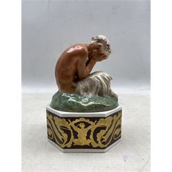 Royal Copenhagen overglazed figure 'Weeping Faun' on octagonal stand, designed by Gerhard Henning, impressed and painted marks, both pieces dated 23.11.26, H17cm