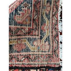 Persian Hamadan red ground runner, the field decorated with floral Herati motifs, trailing border decorated with small stylised flowerheads, framed within guard stripes
