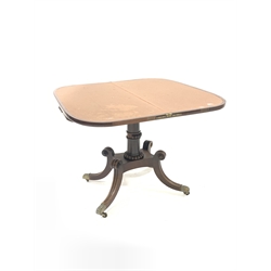 Regency mahogany card table, fold over revolving top revealing baize lined playing surface, beading to frieze over turned column and platform, raised on scrolled out splayed supports terminating in leaf moulded brass cup castors, 