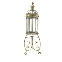 Gilt metal floor lantern with wrought scrolled supports H108cm