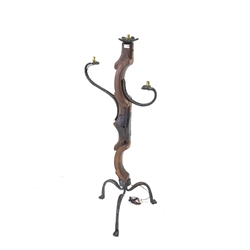 Wrought iron and hardwood standard lamp, with three light fittings and raised on three splayed supports 