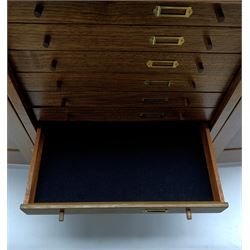 Walnut collectors chest, the interior fitted with ten felt lined drawers enclosed by fielded panel doors, recessed folding brass handles and lockable doors, H38cm, D26cm, W32.5cm 